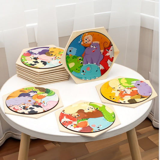 Children's wooden puzzles with animal illustrations on a white table.