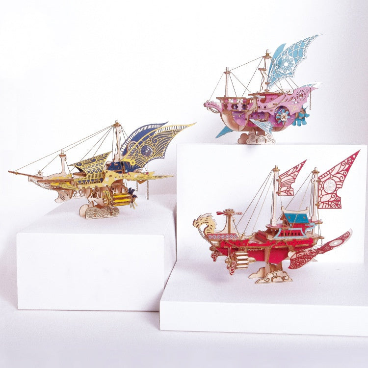Three decorative ship models on white backgrounds