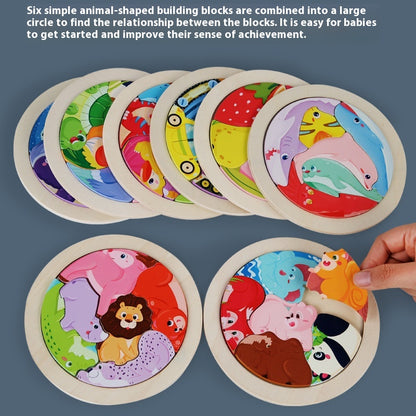 Set of animal-shaped building blocks arranged in a circle with a hand interacting with one of them.