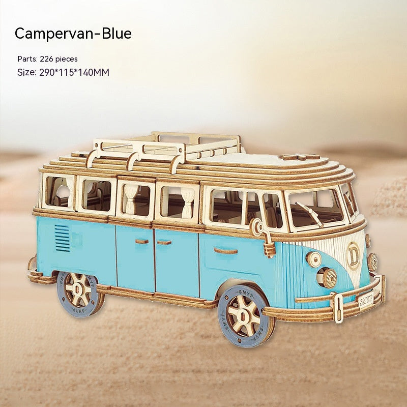 Blue and gold campervan model on a beige background