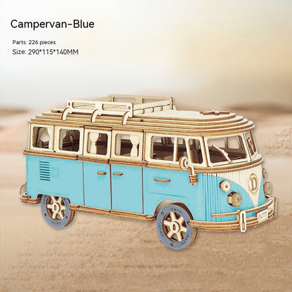 Blue and gold campervan model on a beige background
