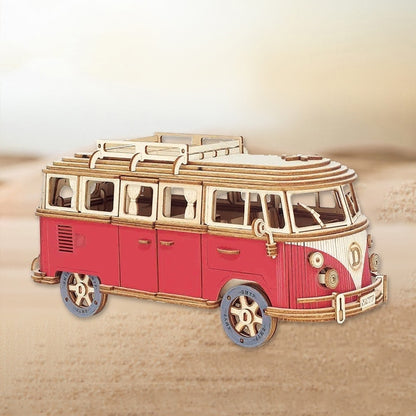 Model of a red and gold van on a beige background