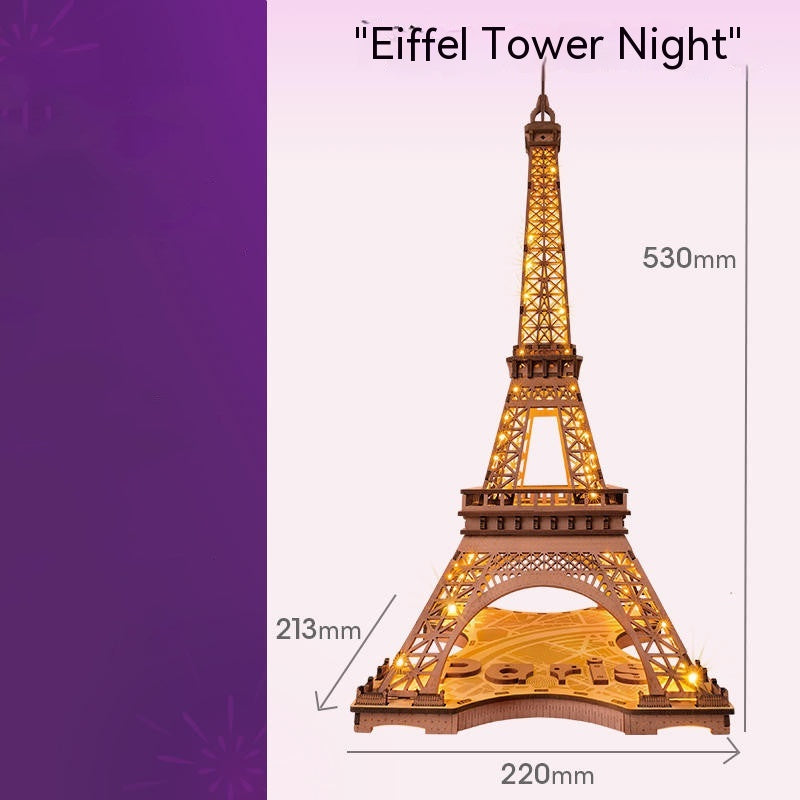 Model of the Eiffel Tower with dimensions on a purple background