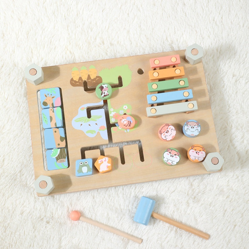 Wooden toy with multiple interactive elements on a white surface