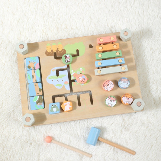 Wooden toy with multiple interactive elements on a white surface