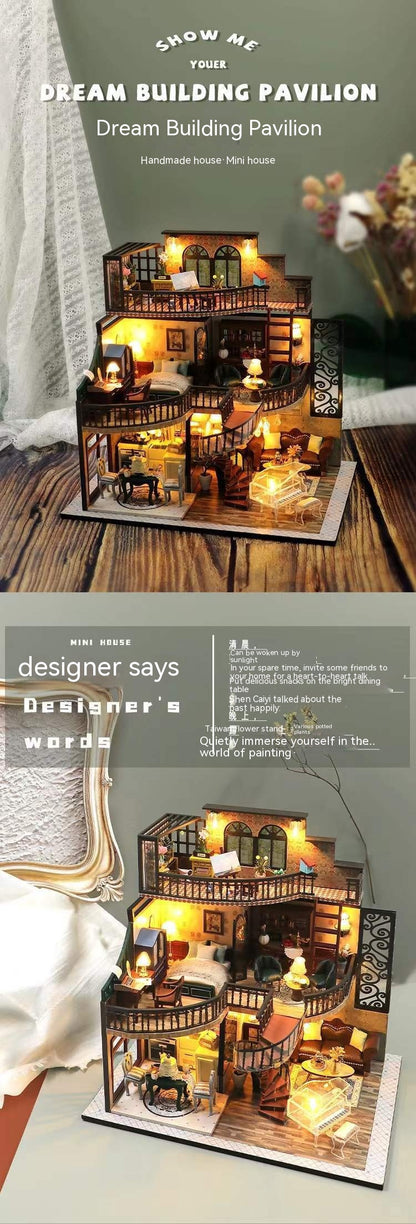 Dream building pavilion with lights on a wooden surface, surrounded by decorative items.