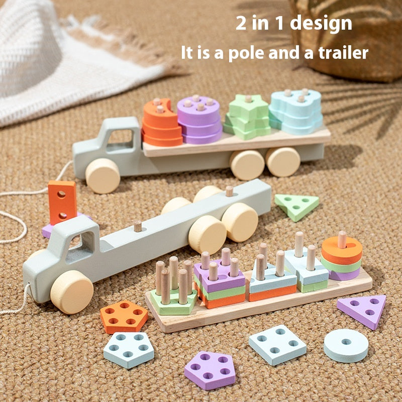 Wooden toy truck with a trailer and shape sorter on a textured surface