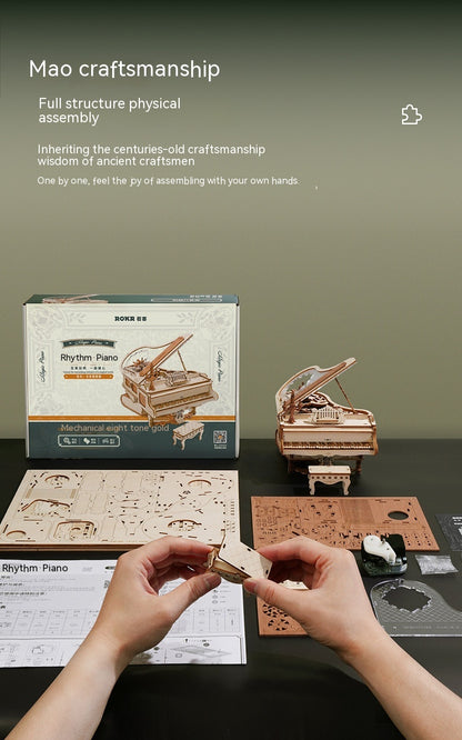 Mao craftsmanship Rhythm Piano model kit with hands assembling the model on a table.