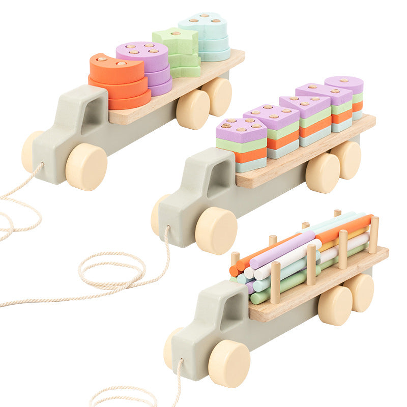 Wooden toy truck with colorful blocks on a white background