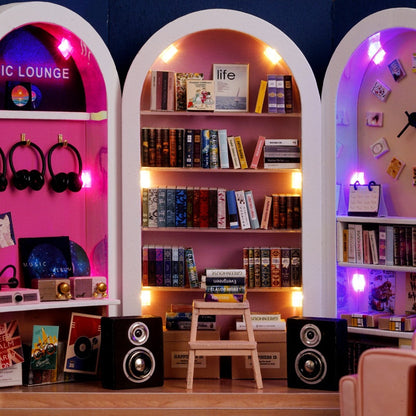 Shelves with books, speakers, and decorative items in a room labeled 'Music Lounge'.