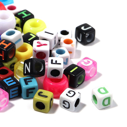 Colorful letter beads on a white background