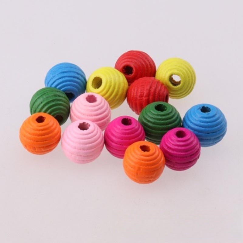 Colorful beehive-shaped beads on a white background