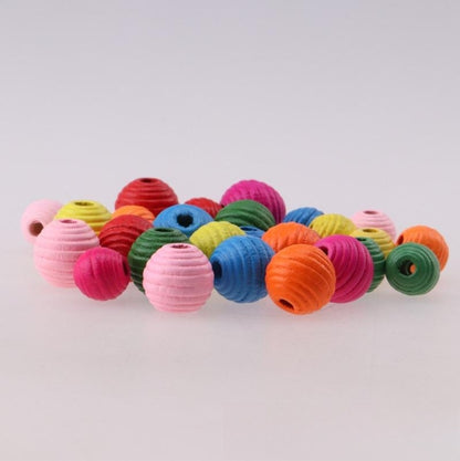 Colorful paper beads on a light gray background